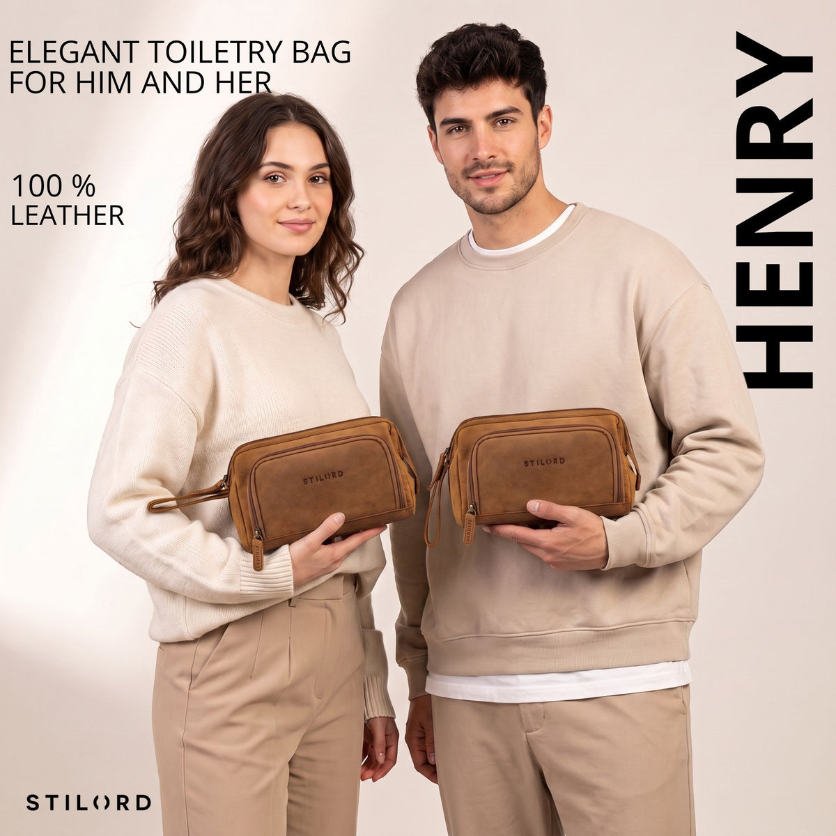 Two people hold Henry tan leather toiletry bag, front view with wrist strap and visible STILORD embossing