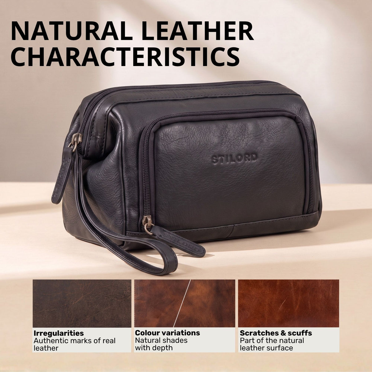 Black leather toiletry bag with STILORD embossing, side view showing wrist strap and zip compartments