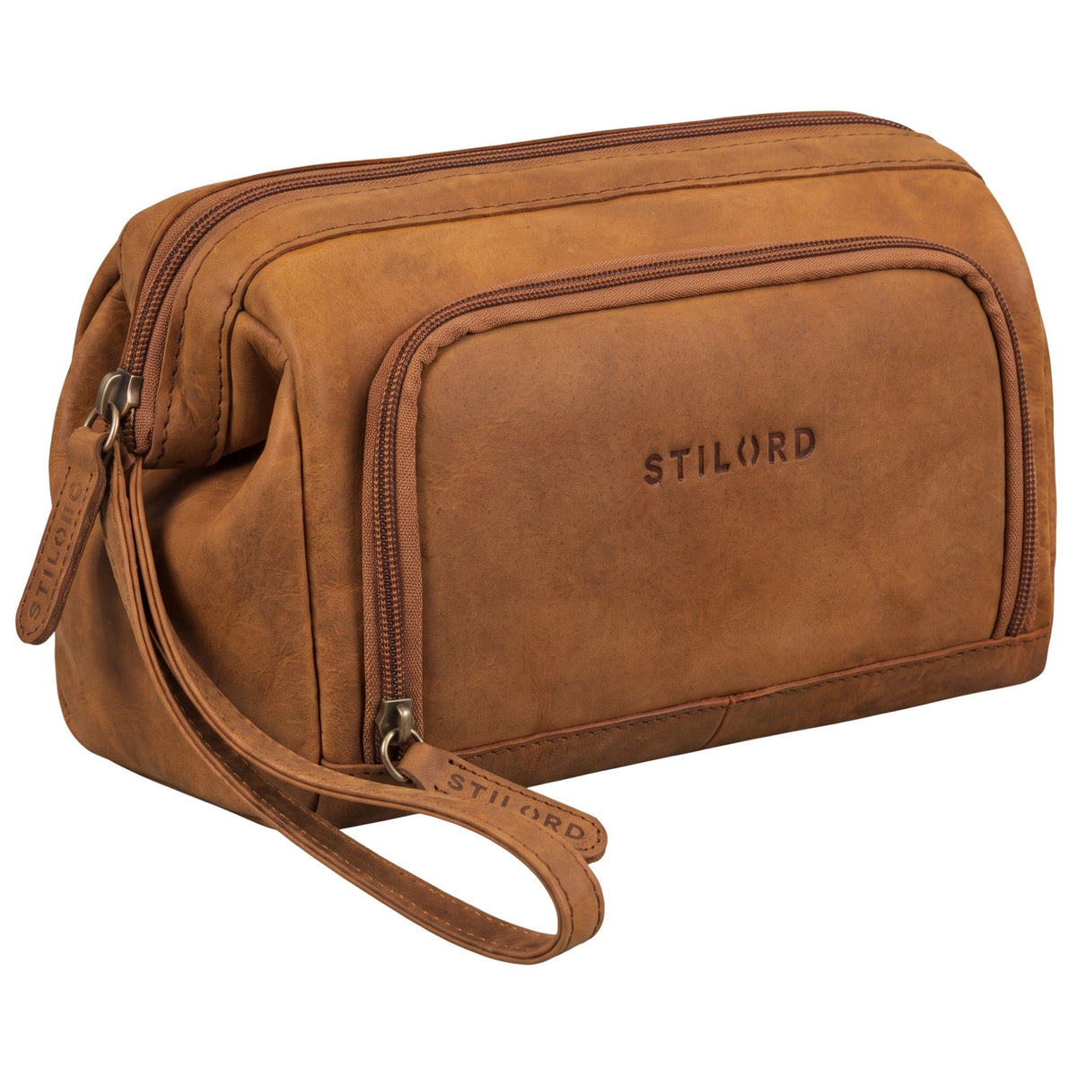Leather toiletry bag in tan and dark brown, side/front view with wrist strap, zip pockets and STILORD embossed logo
