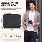 Black leather wallet in landscape format with Vienna box coin compartment, zip closure and visible STILORD embossing, shown in hand