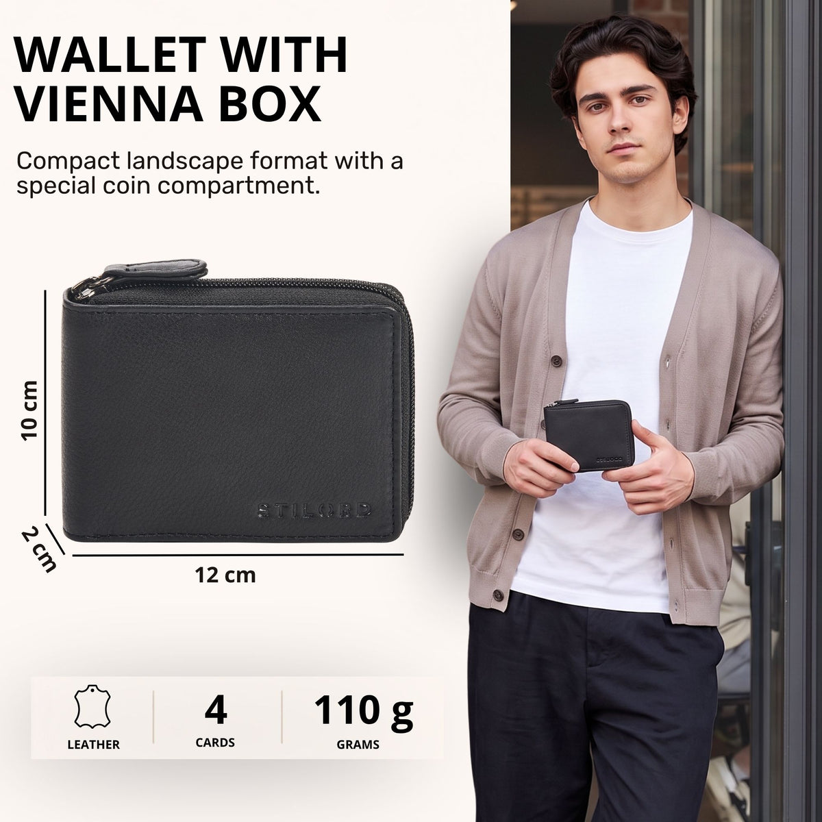Black leather wallet in landscape format with Vienna box coin compartment, zip closure and visible STILORD embossing, shown in hand