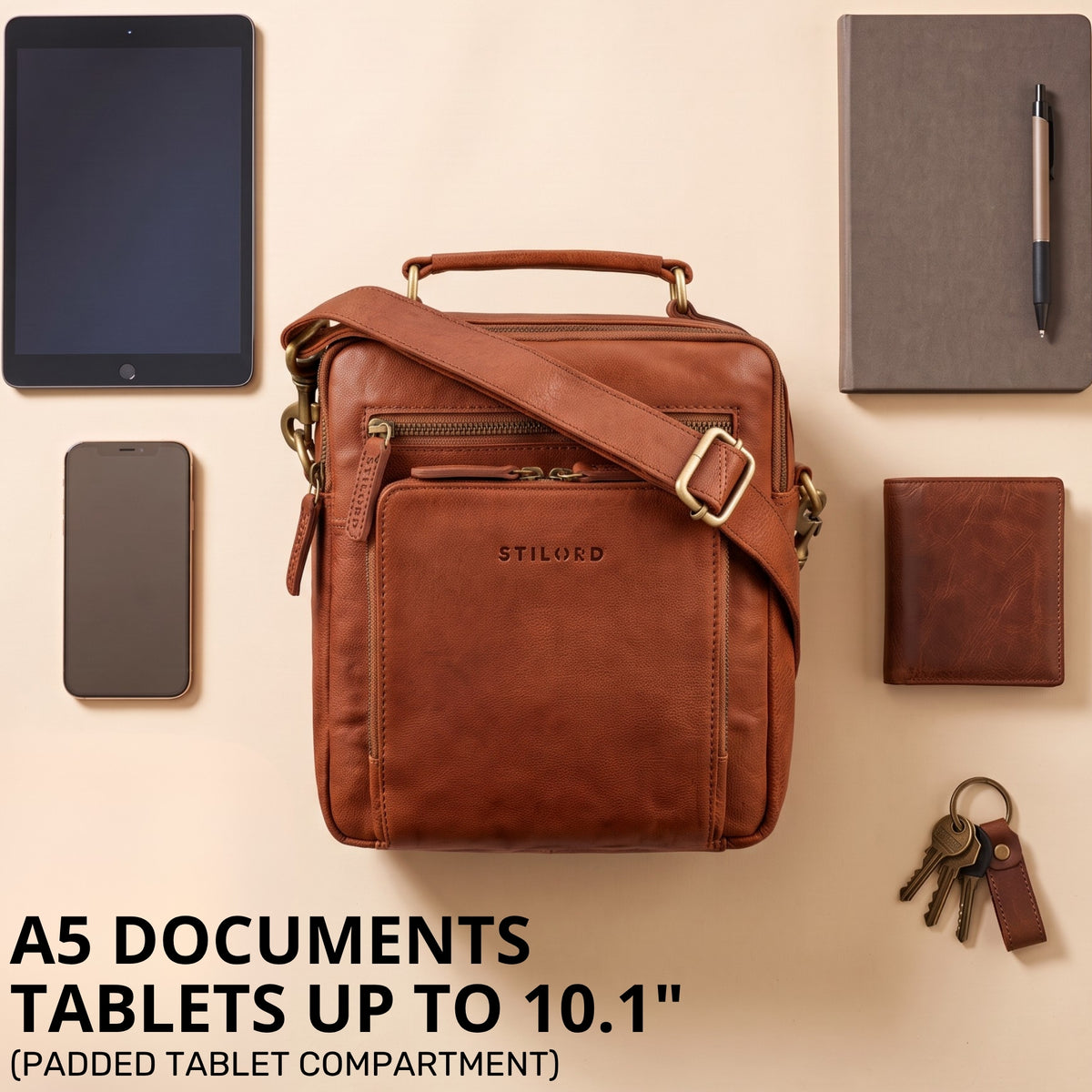 Small brown leather shoulder bag with handle and adjustable strap, front pocket, fits up to 10.1" tablet and A5 documents