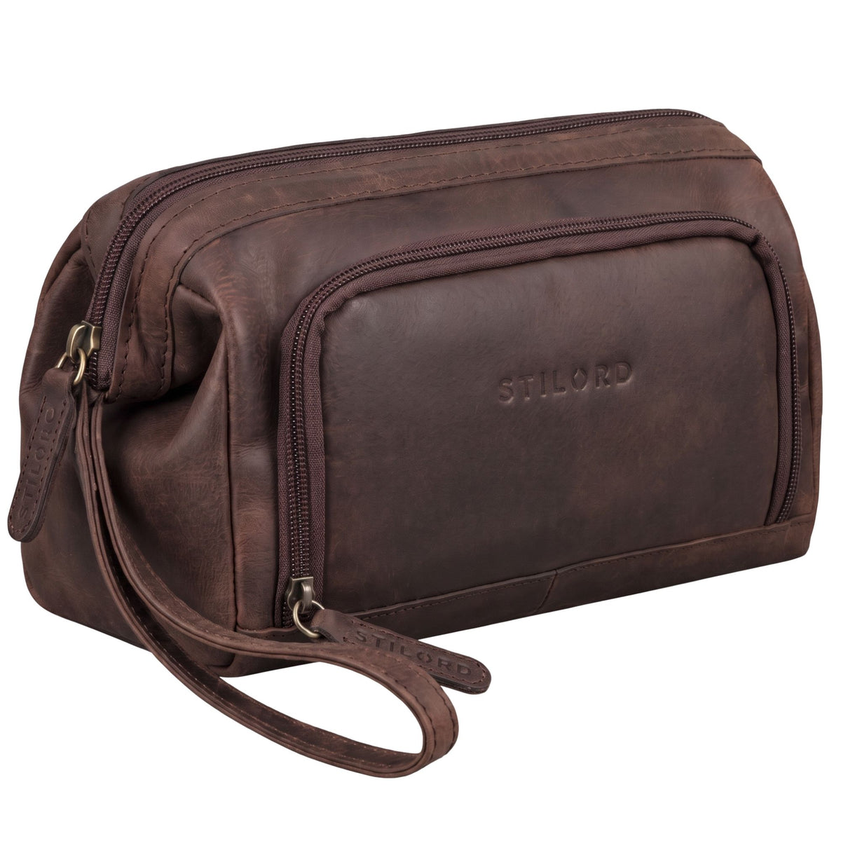 Brown leather toiletry bag Henry with embossed STILORD logo, front pocket and wrist strap, angled side view