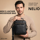 Small black leather crossbody bag with top handle and front zip pocket, STILORD embossing, man holding it front-facing