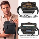 Small black leather crossbody bag held by man, top view of open compartments showing multiple pockets and room for 8-inch tablet